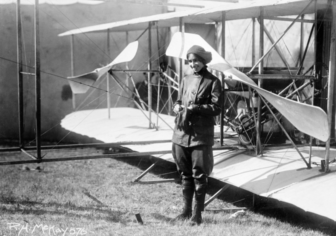 Aviatrix Katherine Stinson, in front of her plane at the Helena Fairgrounds in 1913