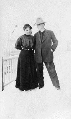 Nancy Russell, whose business acumen made Montana's favorite Cowboy Artist a financial success, poses here with husband Charlie at Chico Hot Springs, 1908. 