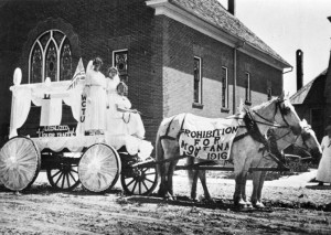 Etta Weatherson, Candace Shaw, Elizabeth Blakeman ride on the WCTU float in 1916 Fourth of July Parade, Columbus, Montana