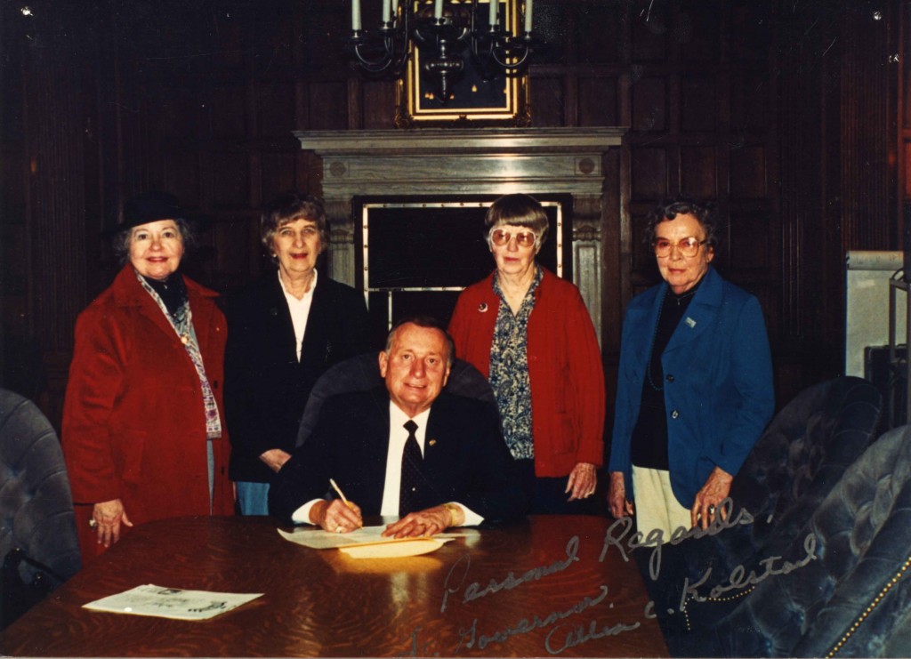 In her campaign to honor women veterans, Doris Brander arranged for five different gubernatorial administrations to sign proclamations honoring and recognizing Montana's women veterans. Shown here at the signing of the 1990 proclamation, with Lieutenant Governor Allan Kolstad, are (left to right) Elsa Xanthopoilos, Margaret Mullen, Helen Dawson, and Doris Brander.