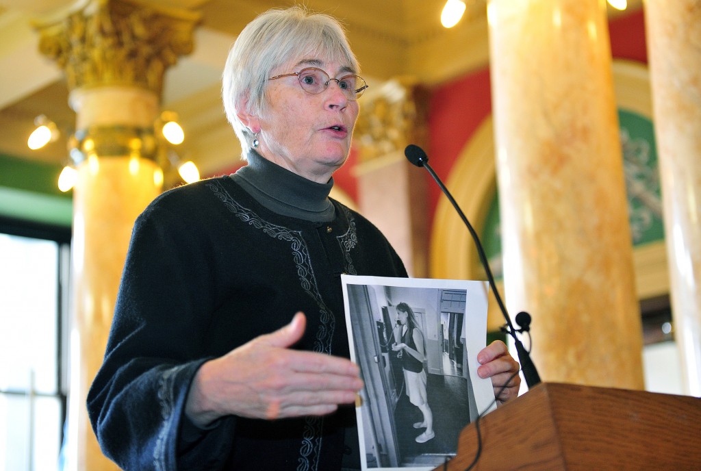 Smith’s activism spanned more than forty years. Pictured here speaking in the Capitol rotunda on January 22, 2013, at an event marking the 40th anniversary of the Supreme Court decision on Roe v. Wade, Smith holds a 1970 photograph of herself engaged in reproductive rights counseling.