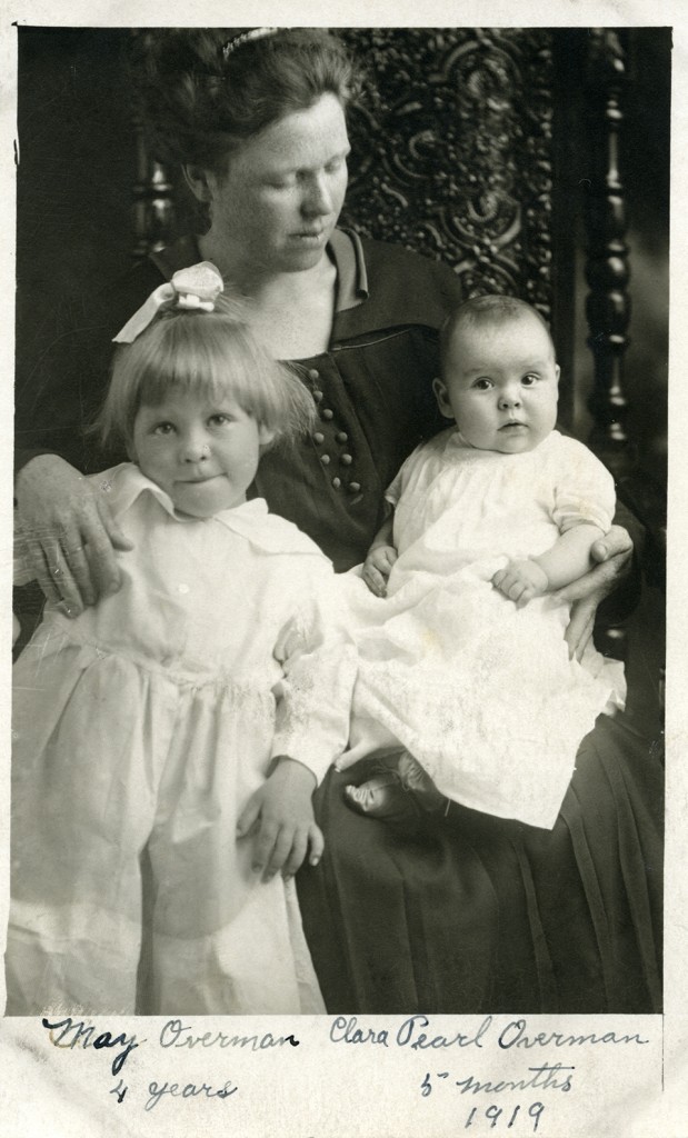 four year old May and five-month-old Clara, both delivered by Fort Benton midwife Mary Kassmeier, posed with their mother in a studio portrait.