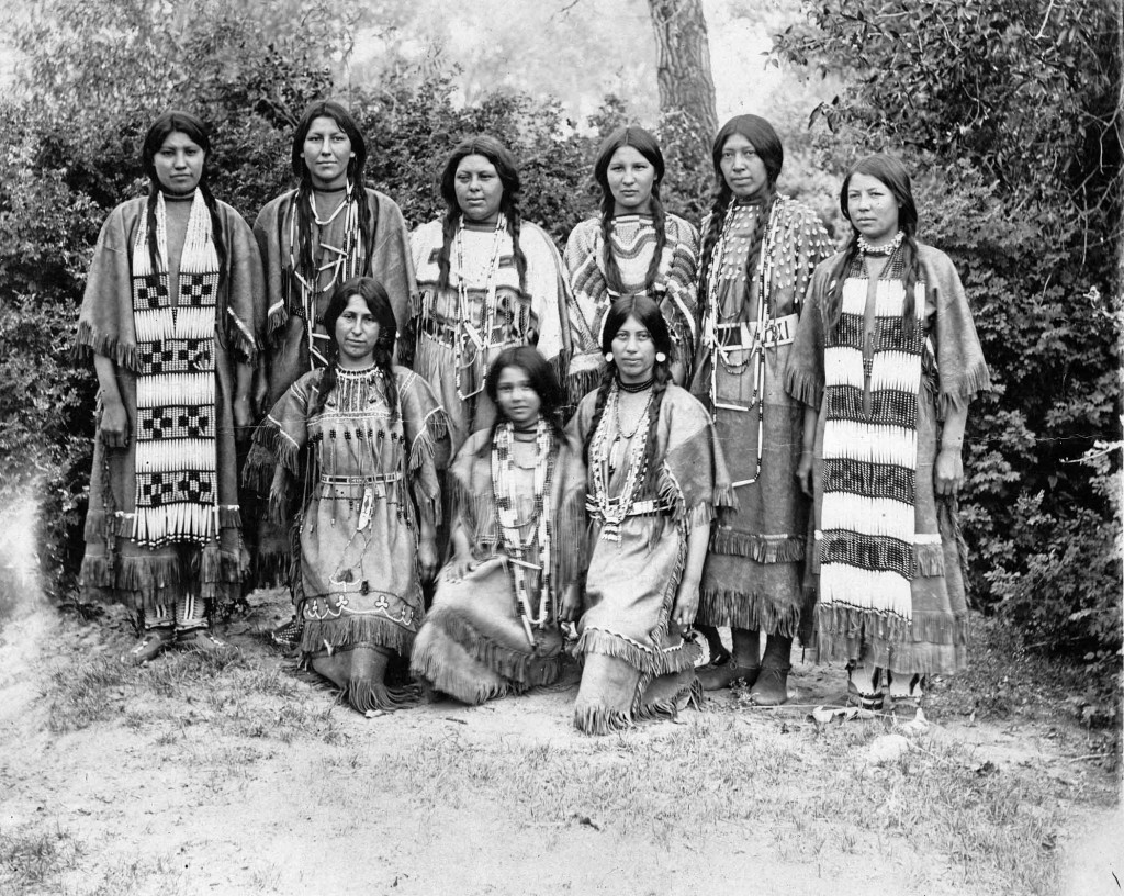 Over the course of five months, more than three million fair-goers gaped at Indian students demonstrating their skills in domestic and industrial arts, drama, and music. However, the almost all-white audience devoted most of its fascination to ten Indian girls playing basketball and, between games, reciting Longfellow’s “Hiawatha” in distinctive buckskin dresses. Standing (from left) are Nettie Wirth, Genevieve Healy, Josephine Langley, Belle Johnson, Minnie Burton, Sarah Mitchell, and kneeling (from left) are Emma Sansaver, Gertrude LaRance, and Rose LaRose. 