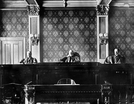 Montana Supreme Court Justices on the bench, circa 1903 in the Capitol building: William T. Piggott and George R. Milburn, Associate Justices and Theodory Brantly, Chief Justice (in center)
